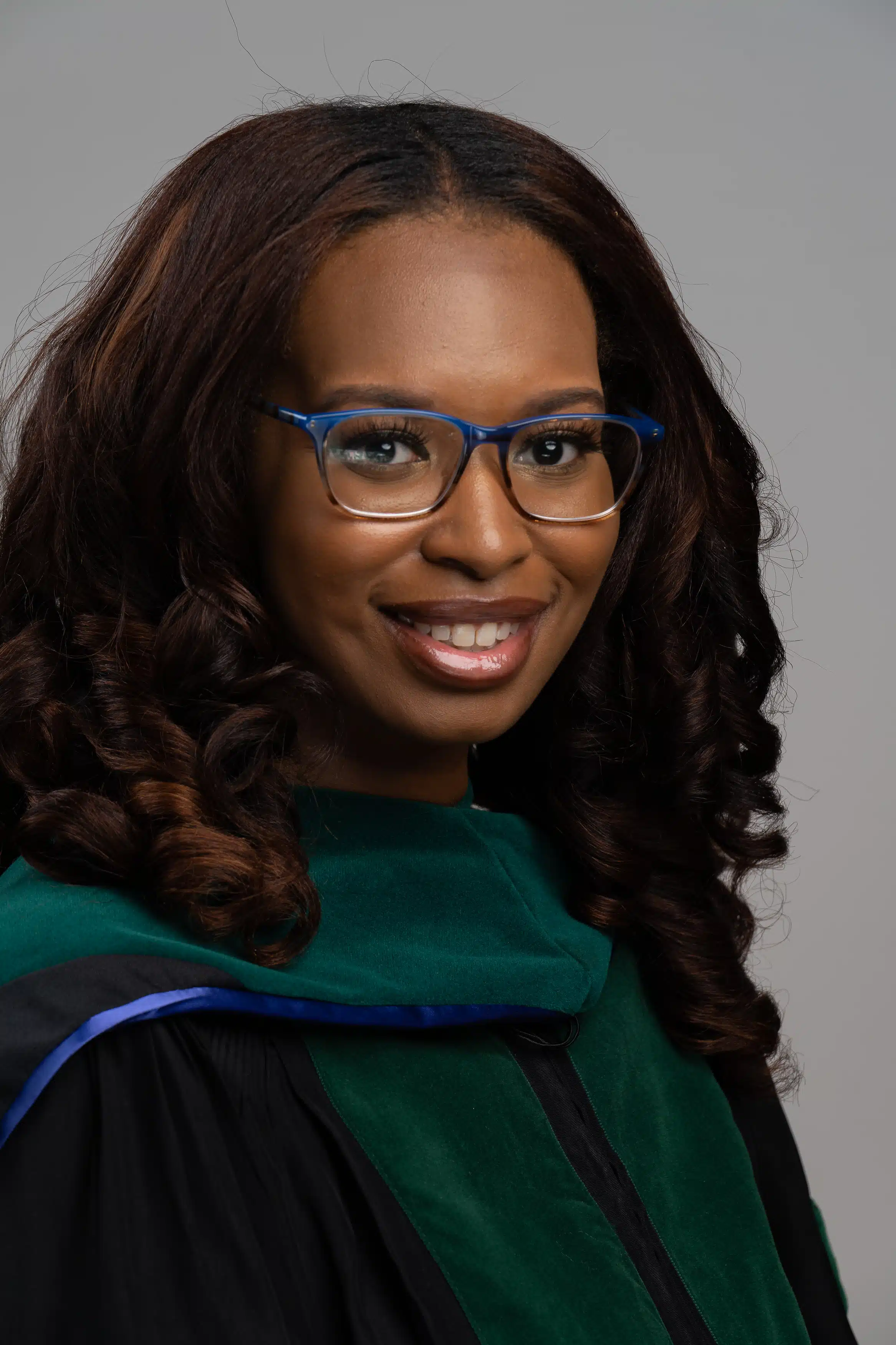 black woman ECU student graduating and taking pre graduation photos and headshot photos for medical school.