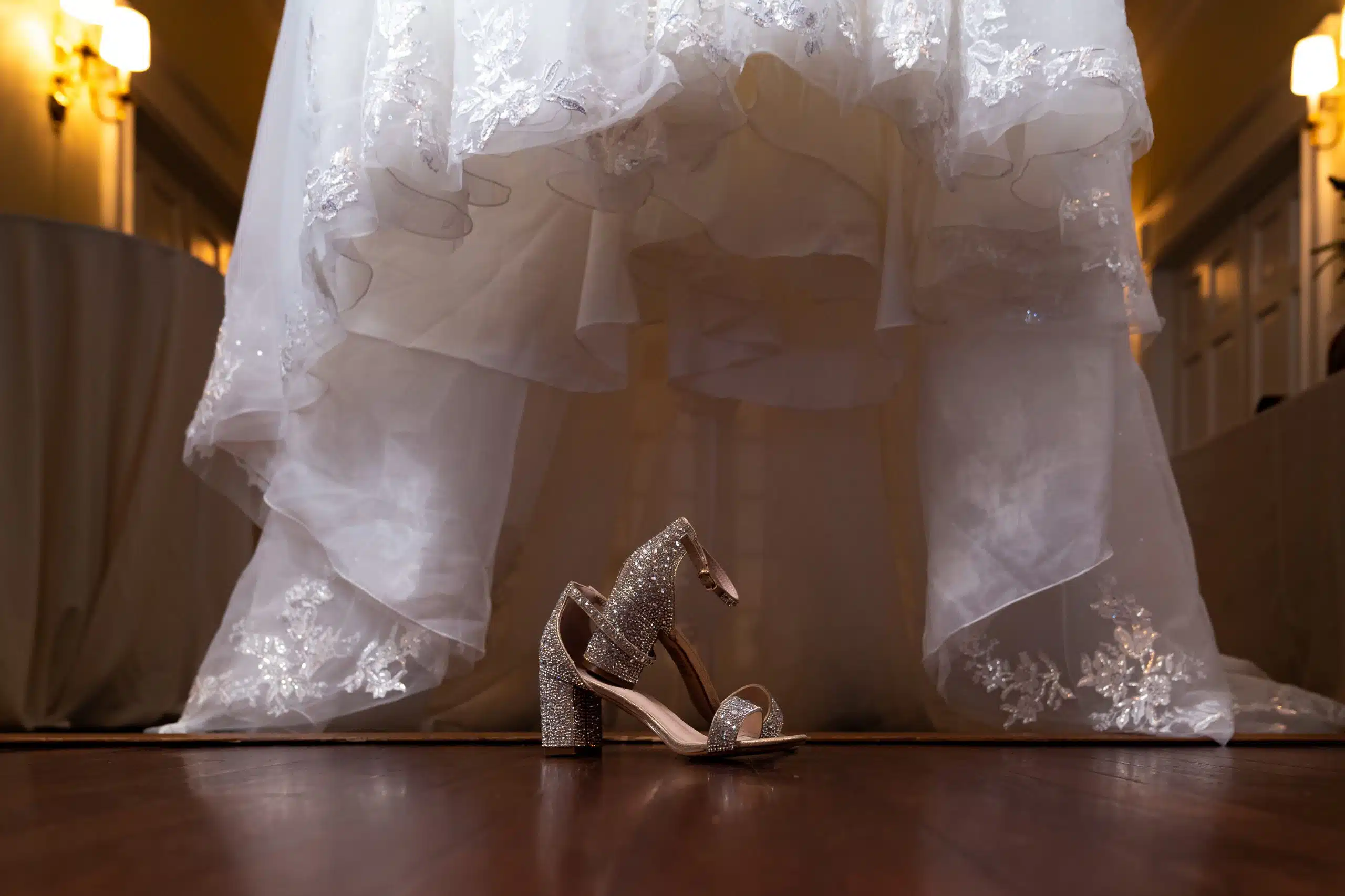 The bride's first wedding dress and shoes. The dress is hanging up at the front of Rock Springs Wedding Venue located in Greenville, NC.